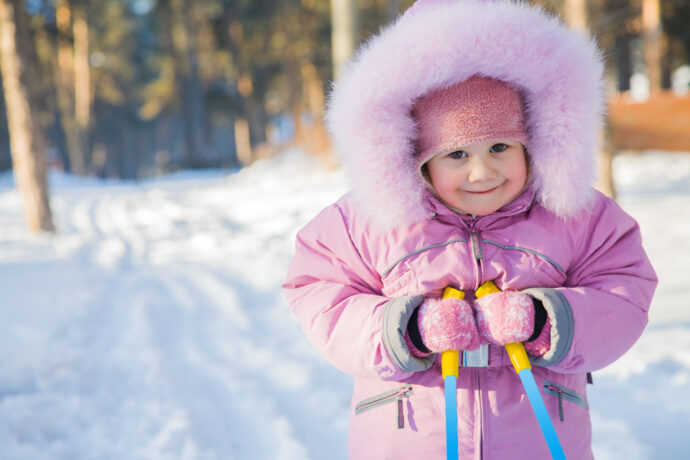 packing warm clothes is essential for a Lapland holiday with kids