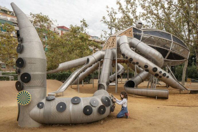 a unique playground with a metal octopus structure